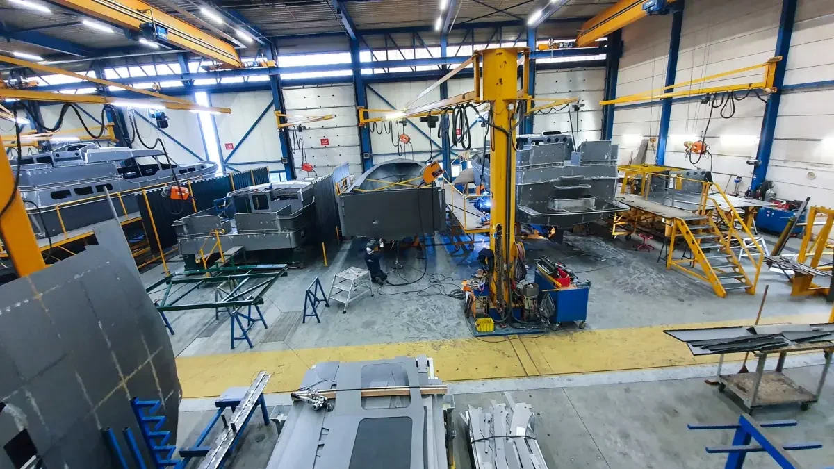 Skilled Linssen craftspeople constructing a steel yacht hull in the Maasbracht shipyard