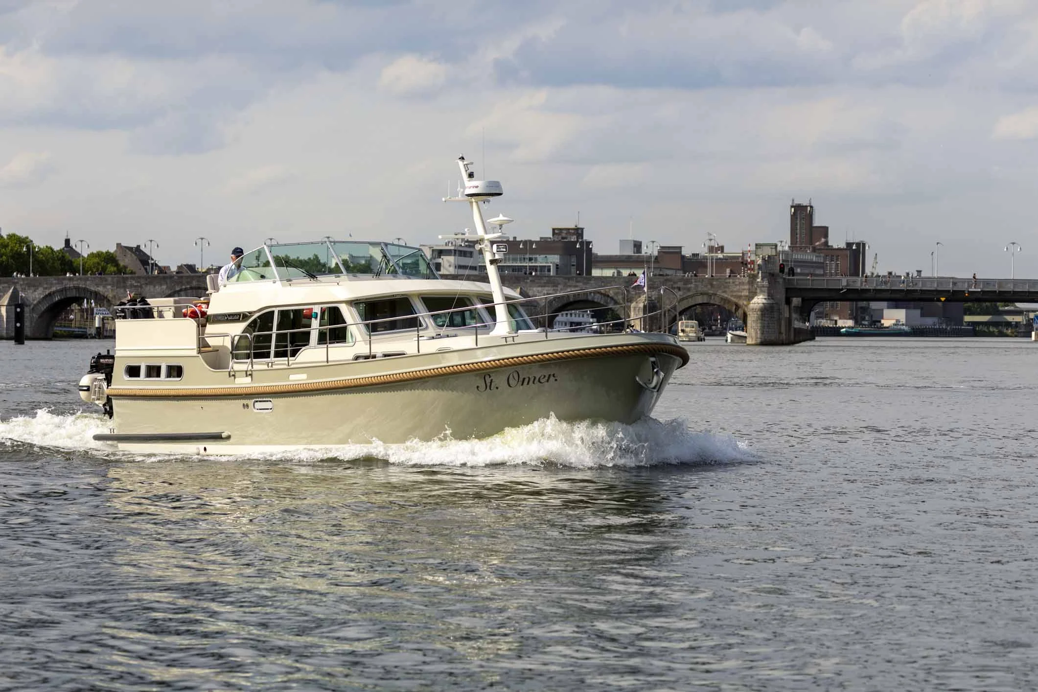 Linssen Grand Sturdy cruising past a historic Dutch waterfront