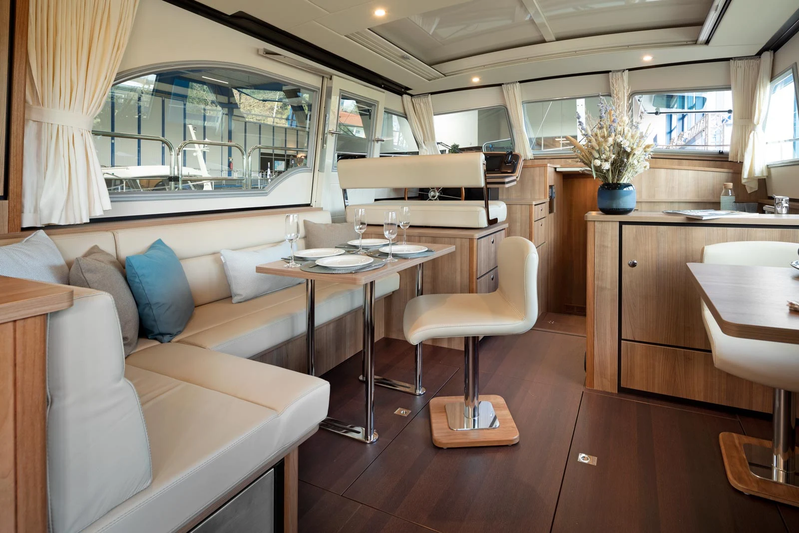 Light-filled Linssen saloon with refined wood finishes and comfortable seating